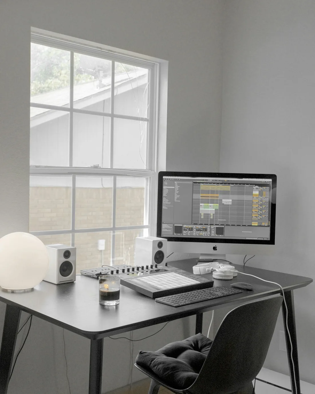 Clean minimal workspace — monitor on a white wood desk